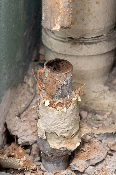 Old water pipe clogged with rust