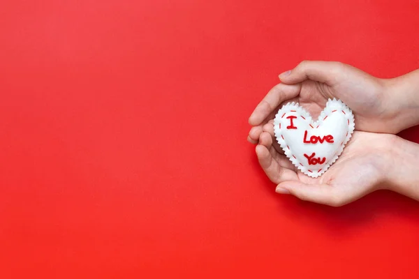 Love You Sewn Valentines Heart Cupped Hands Red Background Fotos de stock libres de derechos