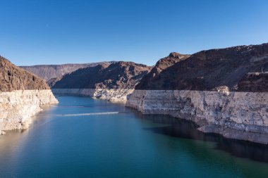 Scenic view of lake at Hoover Dam on sunny day with clear skies
