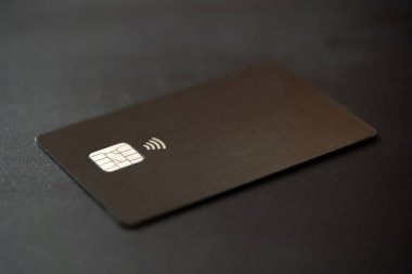 Closeup of single credit card on black background