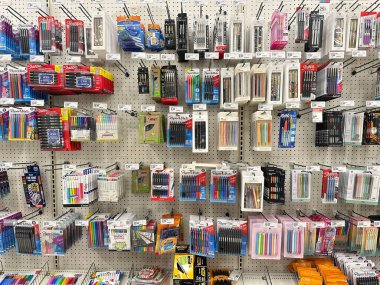 Wixom, Michigan, USA - Sep 21, 2024 : Image of shelves with a different pens and stationery in Target retail store clipart