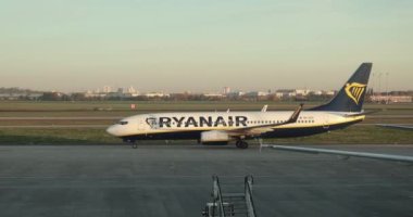 Berlin, Germany - Circa 2022: Ryanair Boeing 737 aircraft coming to a stop at arrival, Berlin Brandenburg Airport, early morning light