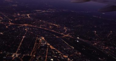 Night flight, city lights of Budapest from an airplane window