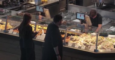 Berlin, Germany - Circa 2022: People buying some fast food at the main train station of Berlin