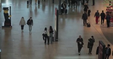 Berlin, Germany - Circa 2022: Interior of the the terminal building at Berlin Brandenburg international airport, passengers passing by duty free shops