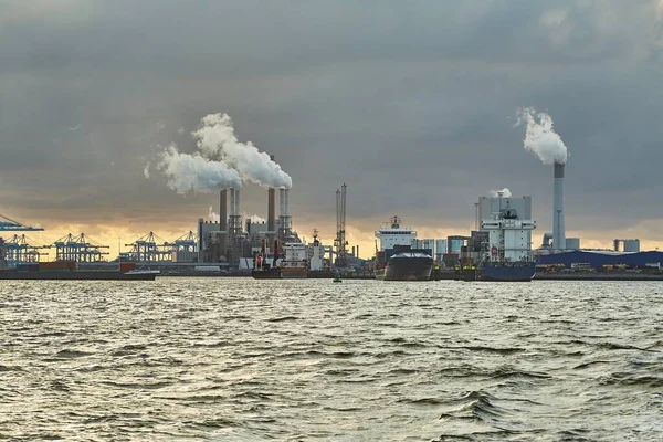 stock image Industrial dock oil terminal and power plants emitting smoke and steam, port industry area of Rotterdam