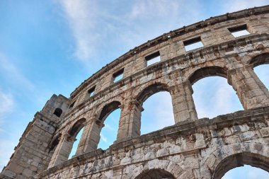 Pula Arena, ancient Roman amphithetre old stone walls of aged building