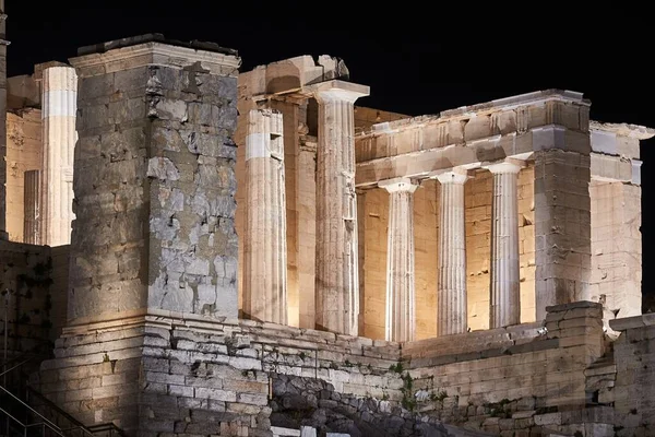 Ancient pillars at the Acropolis of Athens, landmark of the ancient Greek civilization at night