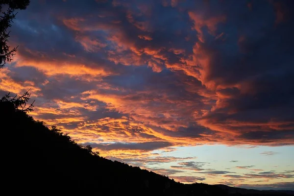 stock image Dramatic sunset clouds glowing in twilight dusk