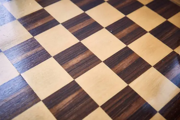 Chessboard checkered pattern background, shiny surface