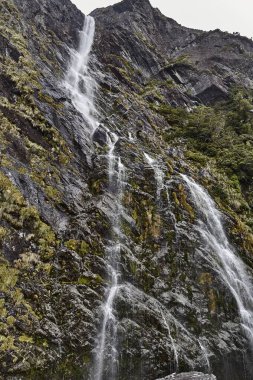 Waterfall coming down on the sharp rocks