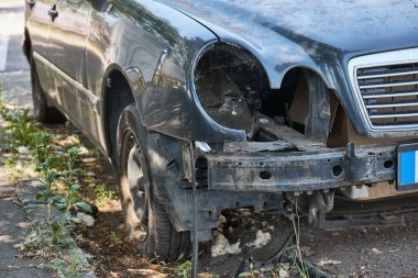 Front part of a wrecked car wreck with missing headlights clipart
