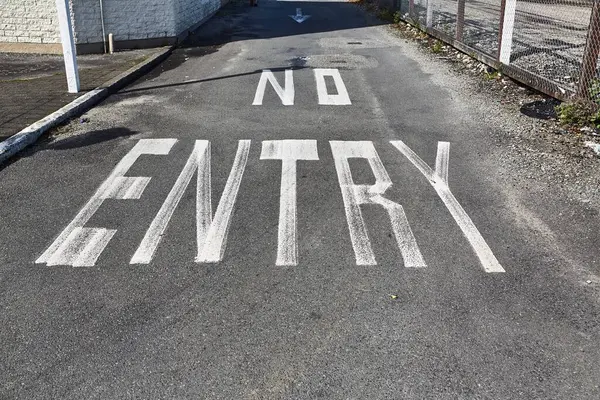 stock image No entry sign painted on asphalt road surface of a one way street