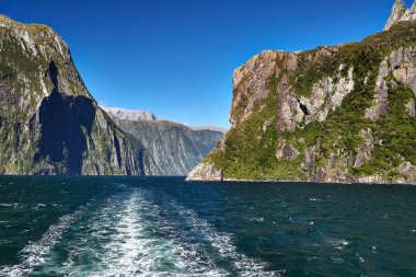 Iconic landscape at Milford Sound in Fiordland, New Zealand. Going on a touristic boat ride