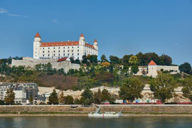 Castle of Bratislava, white building on a hill in the Slovakian capital clipart