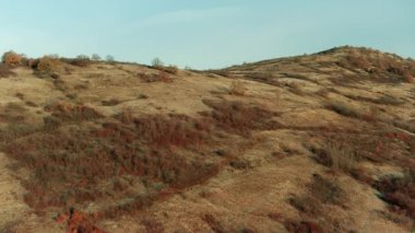 Drone aerial view landscape hills with dry vegetation wasteland