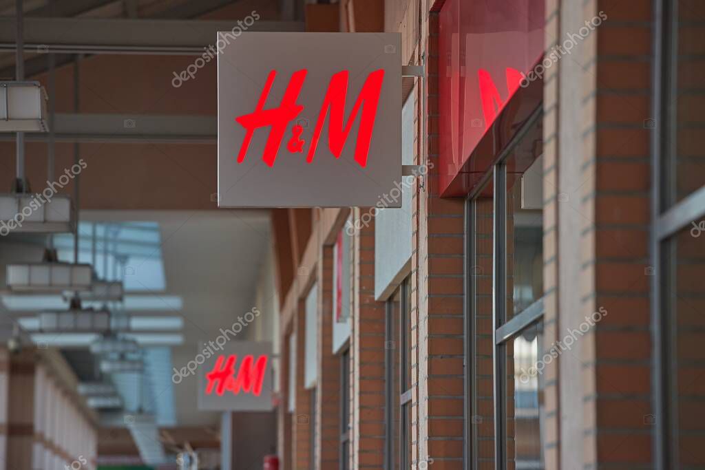 Budapest, Hungary - January 25, 2025: Clothing retail shops of HM, H and M brand of fast fashion in a shopping mall, Logo on the facade