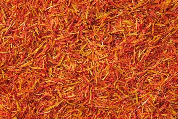 stock image Saffron seasoning background. Organic Saffron or alternative to saffron - Safflower spice texture closeup.