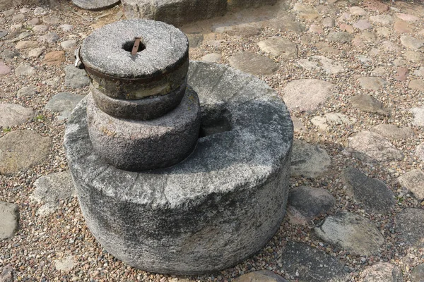 stock image Old ancient stone mill. Millstones for grinding wheat or other grains, grinding stones.