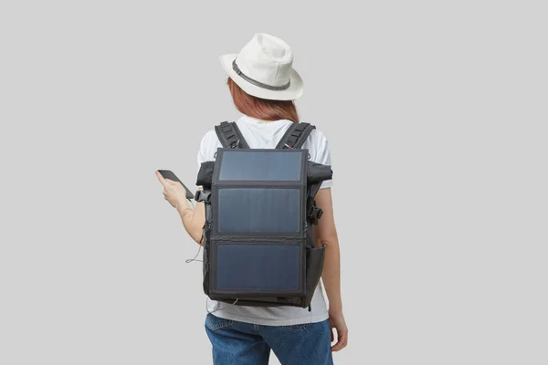 Girl Carrying Backpack Flexible Solar Panel Attached Smartphone Her Hands — Stock Photo, Image