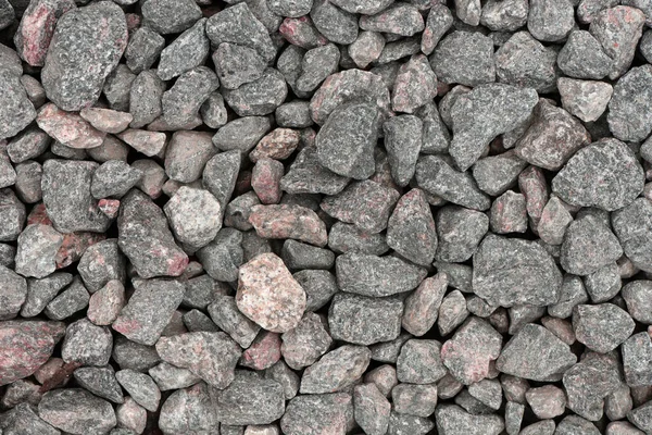 Pile of rubble top view. Top view of gravel or stone. Backdrop of the gray gravel cobblestones. Stone background. Extreme closeup. High resolution photo. Full depth of field.