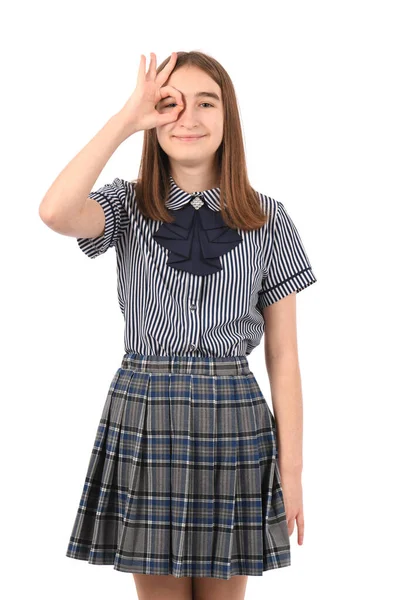 Mladá Krásná Dívka Školní Uniformě Bílém Pozadí Dělá Gesto Ručním — Stock fotografie