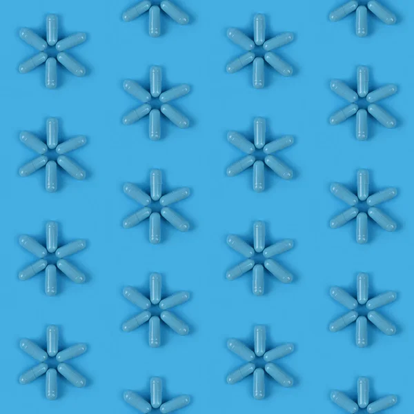 Seamless pattern. Blue medical capsules pill on blue background. High resolution pattern.  Full depth of field.