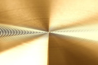 Altın metalin dokusu. Yuvarlak metal dokusu. Metal doku arka planı. Aşırı derecede yakın çekim. Yüksek çözünürlüklü. Tam alan derinliği.