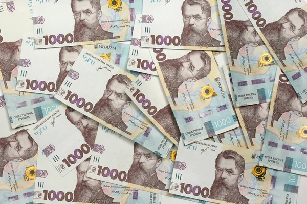 Achtergrond Van Duizend Bankbiljetten Hryvnia Liggend Een Hoop Hoge Resolutie — Stockfoto