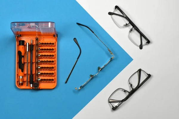 Set Screwdriver Bits Repair Reading Glasses Isolated Blue Background High — Stock Photo, Image