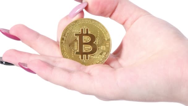 Hand Holds Shows Golden Cryptocurrency Bitcoin White Background Movement Viewer — Stock Video