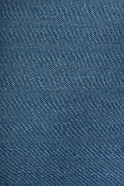 Mavi kot pantolon deseni yakın çekim. Mavi kot pantolon arka planı. Kotlar kumaşa yakın..