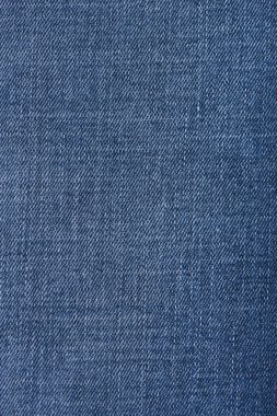 Mavi kot pantolon deseni yakın çekim. Mavi kot pantolon arka planı. Kotlar kumaşa yakın..