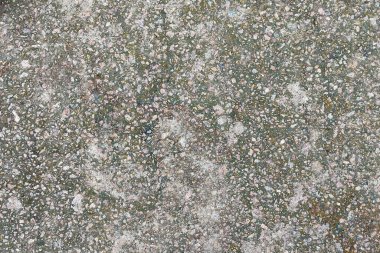 Beton doku. Farklı renkte çakıl taşları ve yaşlanma belirtileri görülebilir. Taş duvar dokusu arkaplan fotoğrafı.