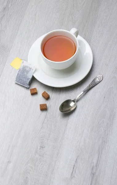 Cup Tea Teabag Spoon Sugar Light Wooden Background — Stock Photo, Image