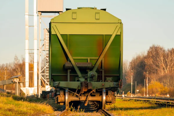 Last wagon of railway bulk carriages in a grain terminal. Railway, freight train with special railway wagons for the grain transport.