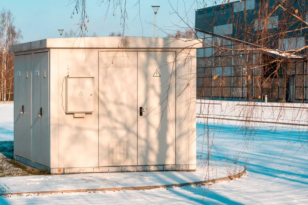 Electric control cabinet stand at side street in a city during winter season
