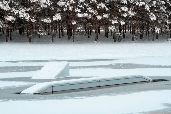 Wake park equipment in a frozen water.Wake park is closed for the winter.Outdoor and extreme sport.