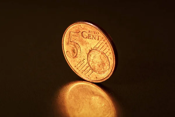 Close-up of  five cent coin on the dark  background. Selective focus.