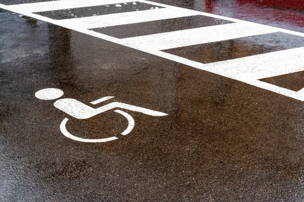 Car parking area for people with disabilities.Free space handicapped parking spot in the city, transportation infrastructure road markings.