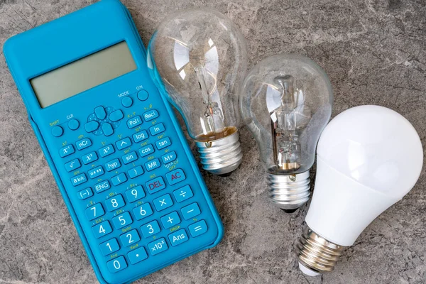 Three Different Types Light Bulbs Blue Modern Calculator Concept Electricity — Stock Photo, Image