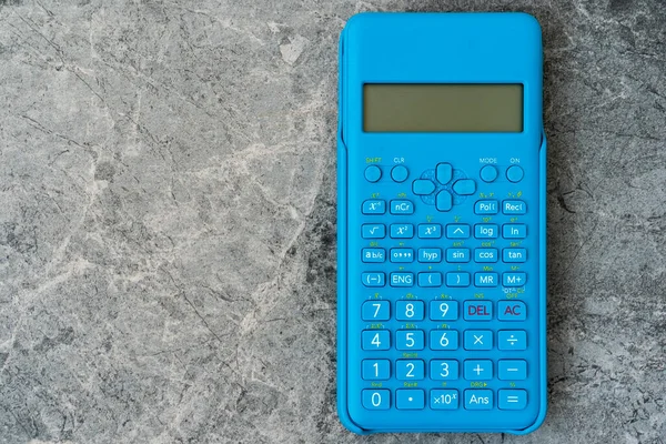 Modern Blue Calculator Grey Stone Background Top View Space Text — Stock Photo, Image