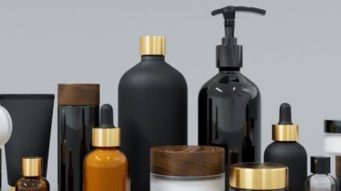 Farklı siyah ve altın renkli cam ve plastik kozmetik şişeler ve kavanozlar, kopyalama alanı, modaya uygun cilt bakımı ve tedavi geçmişi olan birçok güzellik ürünü.