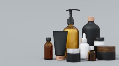 Farklı siyah ve altın renkli cam ve plastik kozmetik şişeler ve kavanozlar, kopyalama alanı, modaya uygun cilt bakımı ve tedavi geçmişi olan birçok güzellik ürünü.