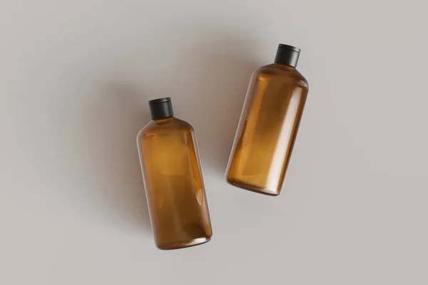 Dvě Hnědé Plastové Kosmetické Nádoby Šampon Láhve Ležící Šedém Pozadí — Stock fotografie