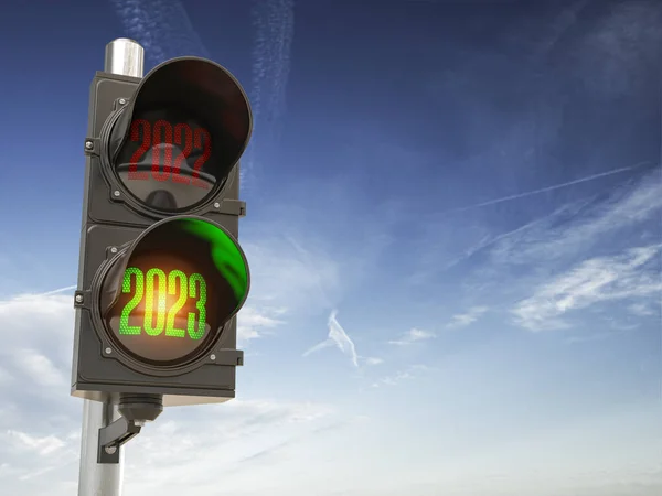 Traffic light with green light 2023 and red 2022 on sky background. Start New 2023 Year concept. 3d illustration