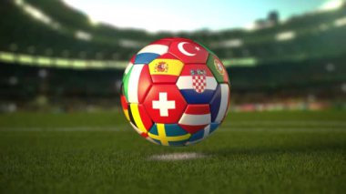 Futbol stadyumunun çimlerinde Avrupa ülkelerinin bayrakları olan futbol topu. Avrupa Şampiyonası 2021. 