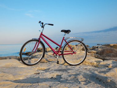 Bicycle on the rocky coast of the sea. Rocky coast of the Caspian Sea. Mangistau region. Kazakhstan. 23 September 2020 year.