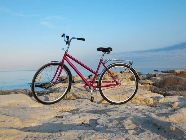 Bicycle on the rocky coast of the sea. Rocky coast of the Caspian Sea. Mangistau region. Kazakhstan. 23 September 2020 year.