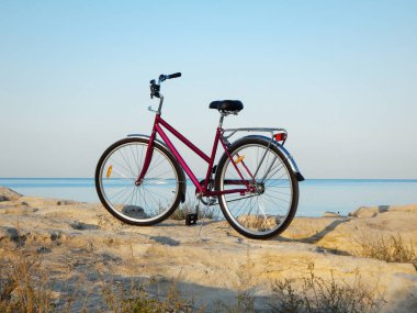 Bicycle on the rocky coast of the sea. Rocky coast of the Caspian Sea. Mangistau region. Kazakhstan. 23 September 2020 year.